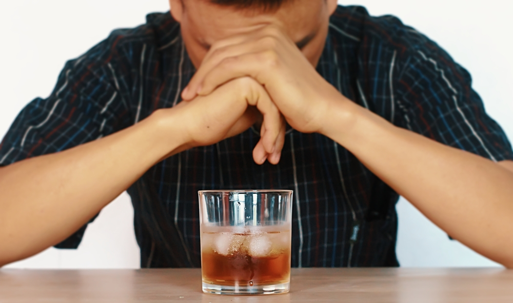 man struggling not to drink alcoholism